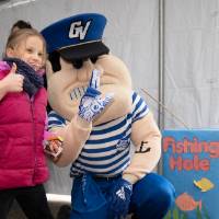 louie takes picture with little girl